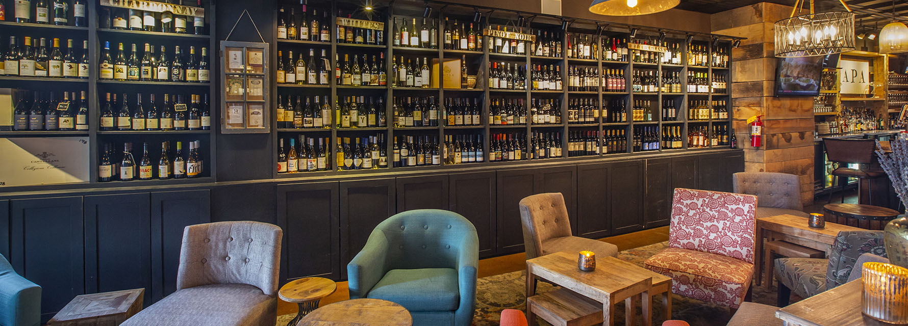 Soft seating area and wine wall inside Napa Kitchen + Bar, Westerville, Ohio